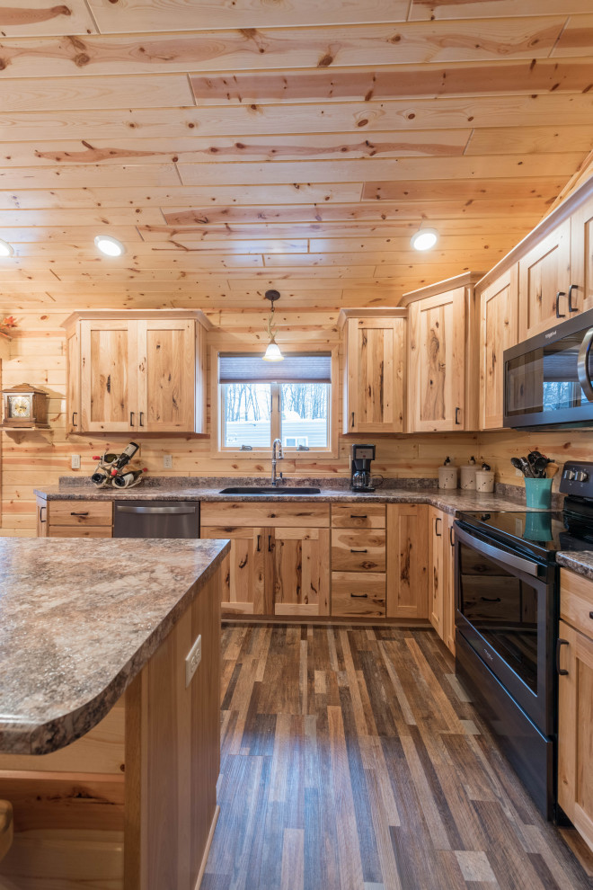 Mid-sized country l-shaped eat-in kitchen in Minneapolis with an undermount sink, shaker cabinets, medium wood cabinets, laminate benchtops, stainless steel appliances, linoleum floors, with island, multi-coloured floor and turquoise benchtop.