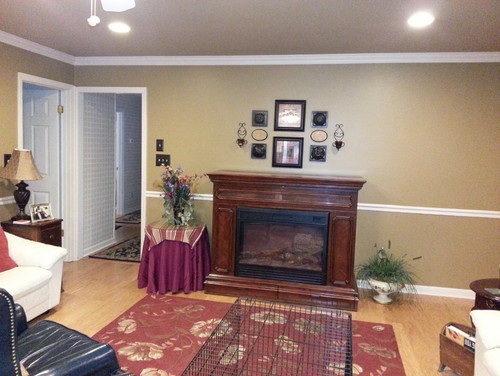 Need help decorating around my freestanding fireplace/lift TV cabinet I have a Fireplace/Lift TV cabinet that stands out 26 inches from the wall. There are two entry exit doors to the left of the cabinet if you are standing in front looking at it