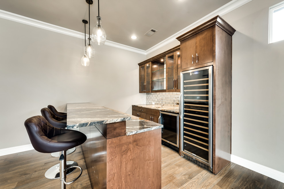 Design ideas for a large contemporary galley wet bar in Dallas with an undermount sink, shaker cabinets, dark wood cabinets, quartz benchtops, mirror splashback and cork floors.