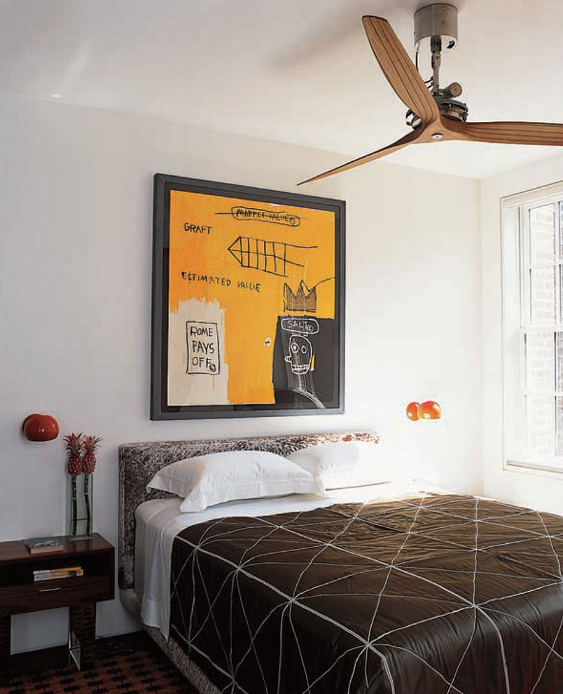 This is an example of a contemporary guest bedroom in New York with white walls.