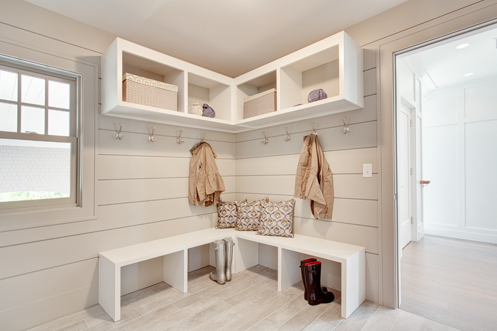 Design ideas for a large transitional mudroom in Other with beige walls, porcelain floors and beige floor.