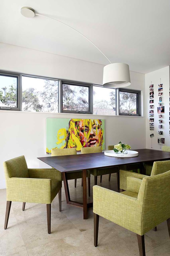 Design ideas for a mid-sized contemporary separate dining room in Sydney with white walls, limestone floors and beige floor.