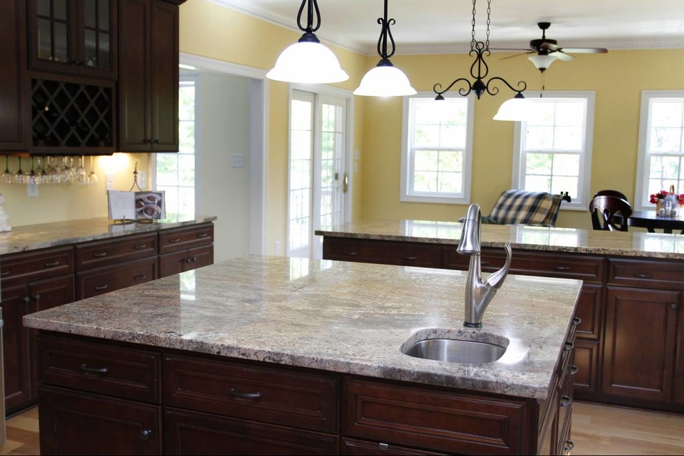 Kitchen - kitchen idea with white cabinets, granite countertops and cement tile backsplash