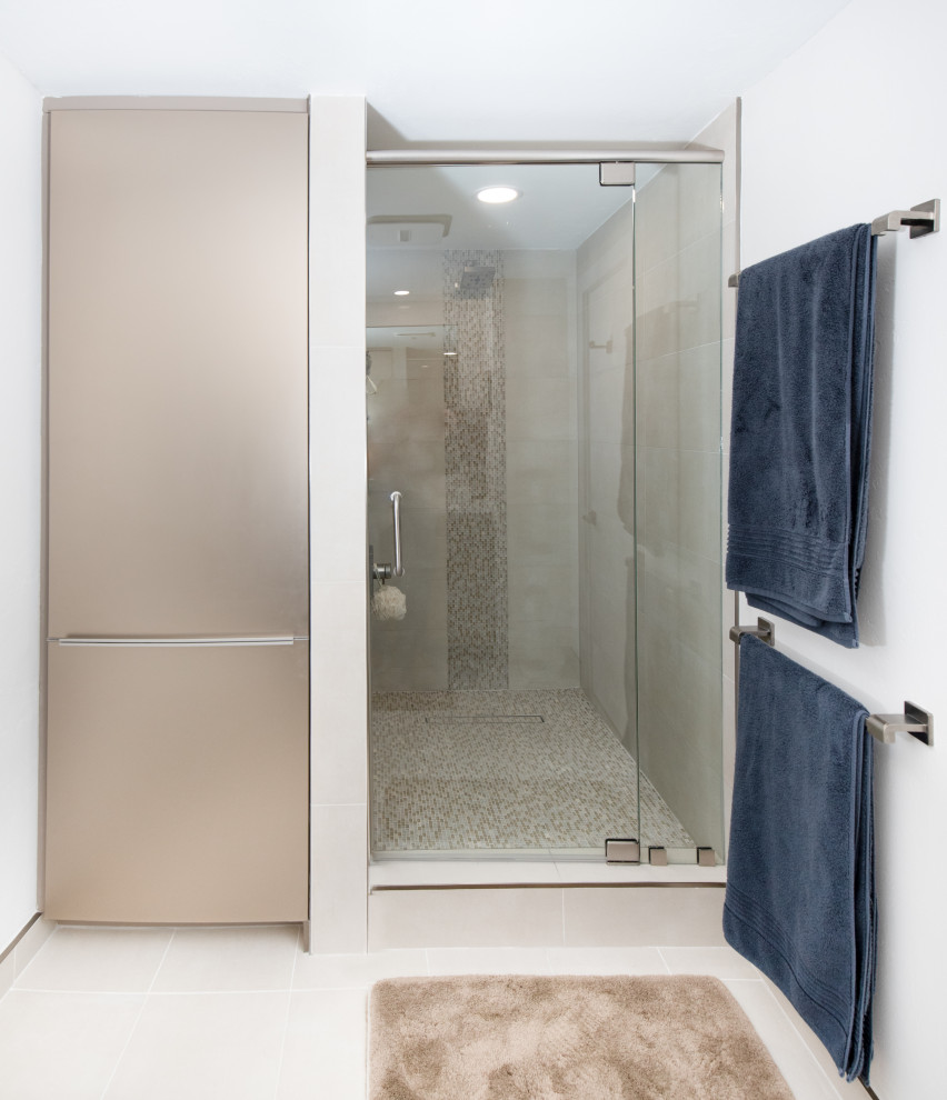 Photo of a medium sized contemporary ensuite bathroom in Miami with flat-panel cabinets, brown cabinets, beige tiles, stone tiles, white walls, porcelain flooring, a submerged sink, engineered stone worktops, beige floors, a hinged door, white worktops, a shower bench, double sinks and a freestanding vanity unit.