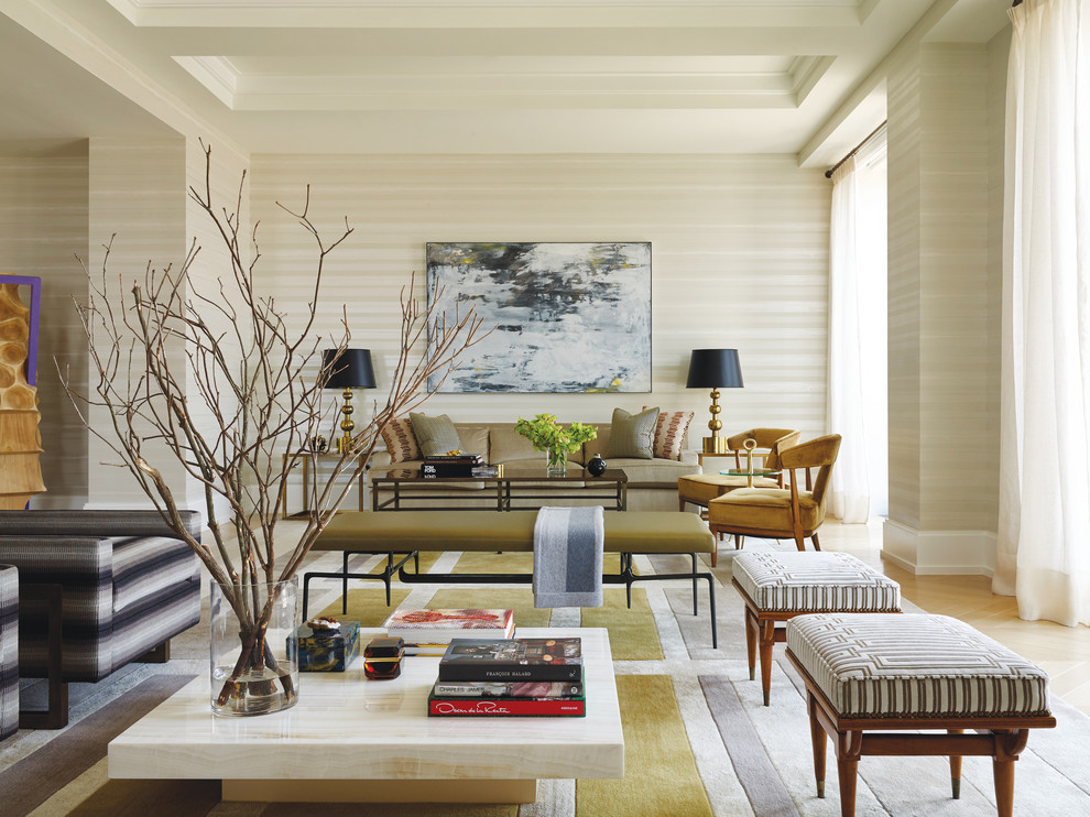 Design ideas for a contemporary open concept living room in New York with beige walls and light hardwood floors.