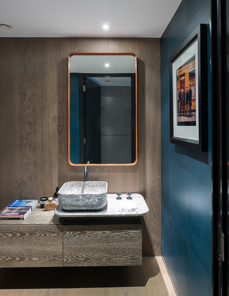 This is an example of a mid-sized contemporary master bathroom in San Francisco with a vessel sink, flat-panel cabinets, distressed cabinets, marble benchtops, multi-coloured walls and light hardwood floors.