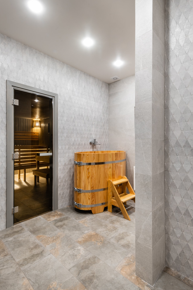 Photo of a mid-sized contemporary bathroom in Moscow with flat-panel cabinets, medium wood cabinets, a curbless shower, gray tile, ceramic tile, grey walls, porcelain floors, a drop-in sink, grey floor and white benchtops.