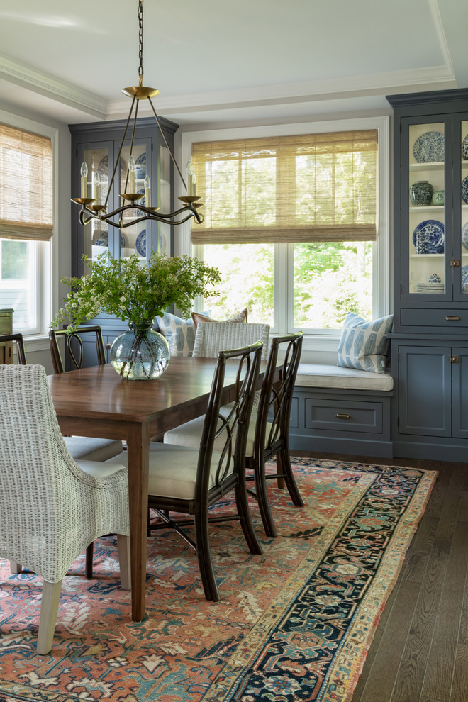 Traditional separate dining room in Boston with grey walls, dark hardwood floors and brown floor.