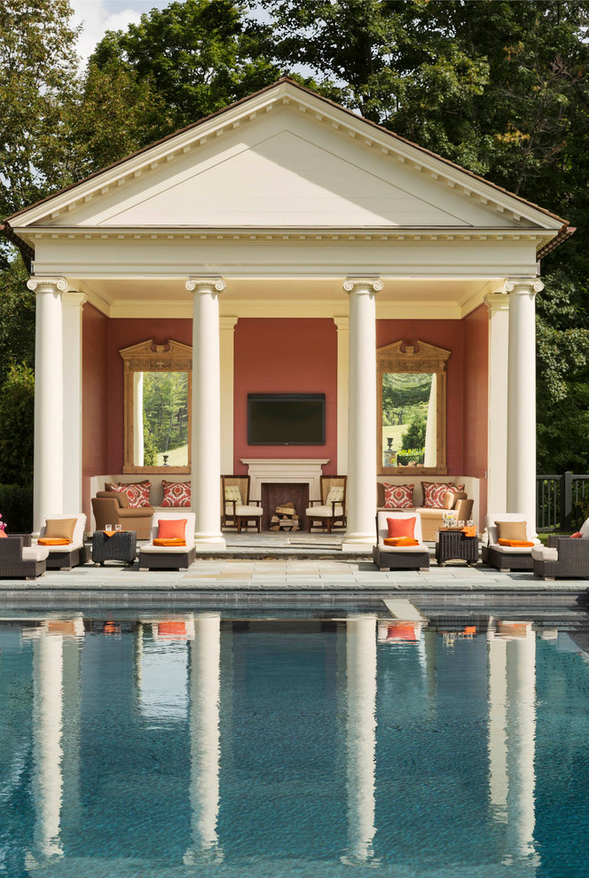 Inspiration for a traditional backyard rectangular pool in New York with a pool house.