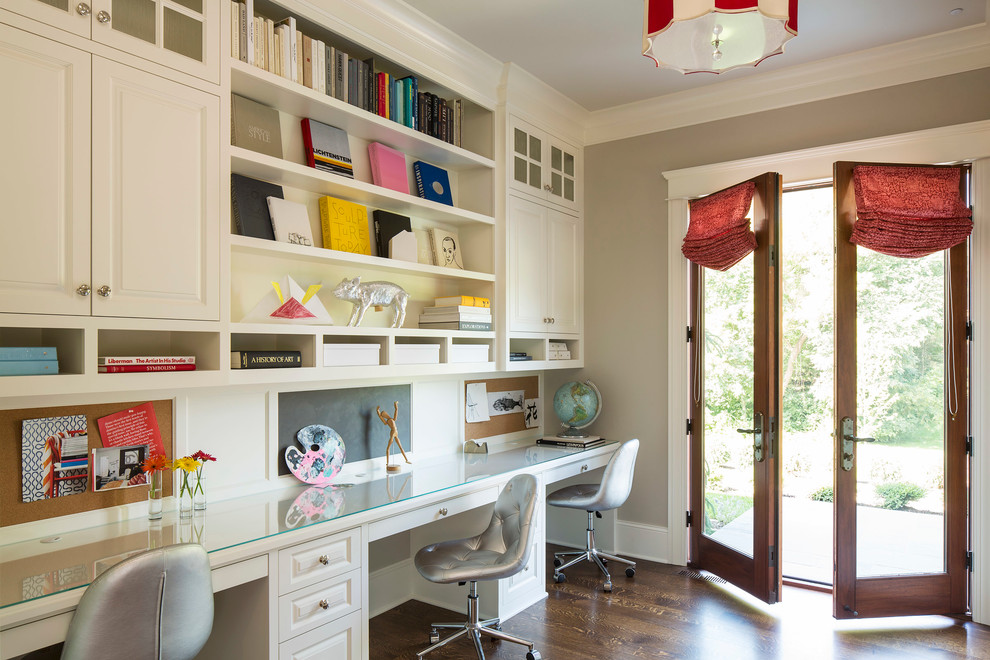 This is an example of a traditional home office in Minneapolis with grey walls.