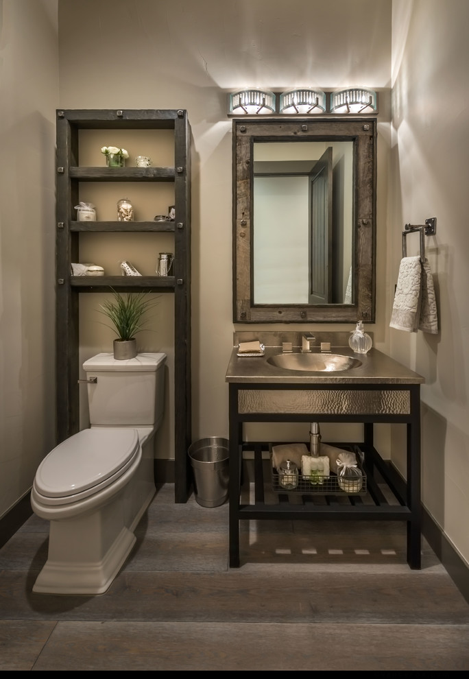Country powder room in Other with furniture-like cabinets, beige walls and dark hardwood floors.