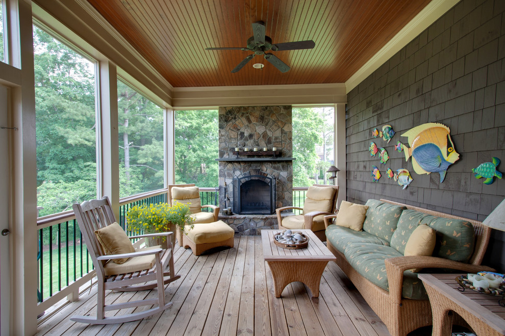 This is an example of a traditional verandah in Raleigh with a fire feature and decking.