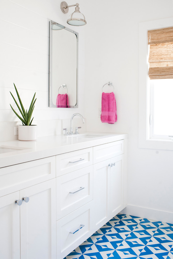 Inspiration for a mid-sized transitional kids bathroom in Orange County with shaker cabinets, white cabinets, white tile, ceramic tile, white walls, cement tiles, an undermount sink and turquoise floor.
