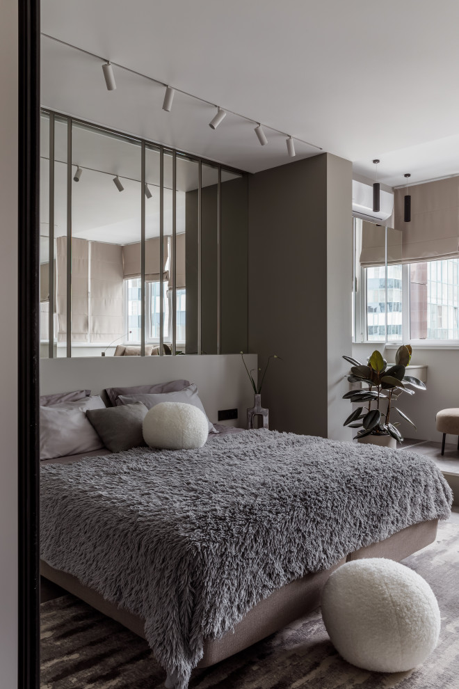 Foto de dormitorio gris y blanco actual de tamaño medio con paredes grises, suelo vinílico y suelo gris