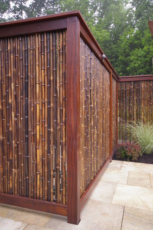 A beautiful and luxurious bamboo fence that shows off the many different shades bamboo can come in. Some stalks are mahogany, while others are the yellow natural color we usually expect from bamboo.