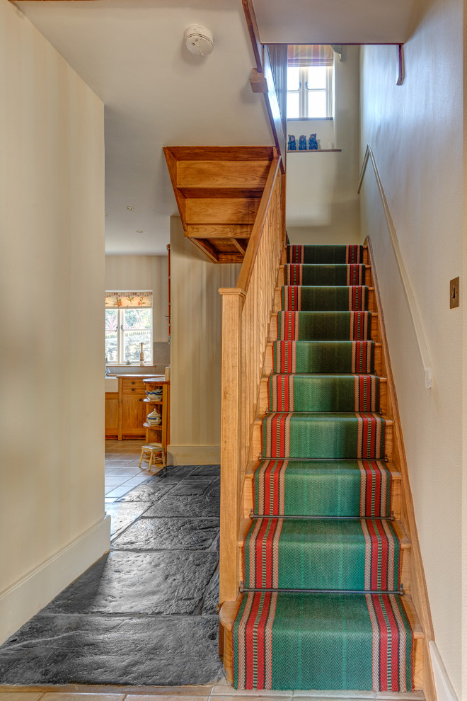 This is an example of a country wood staircase in Devon with wood risers.