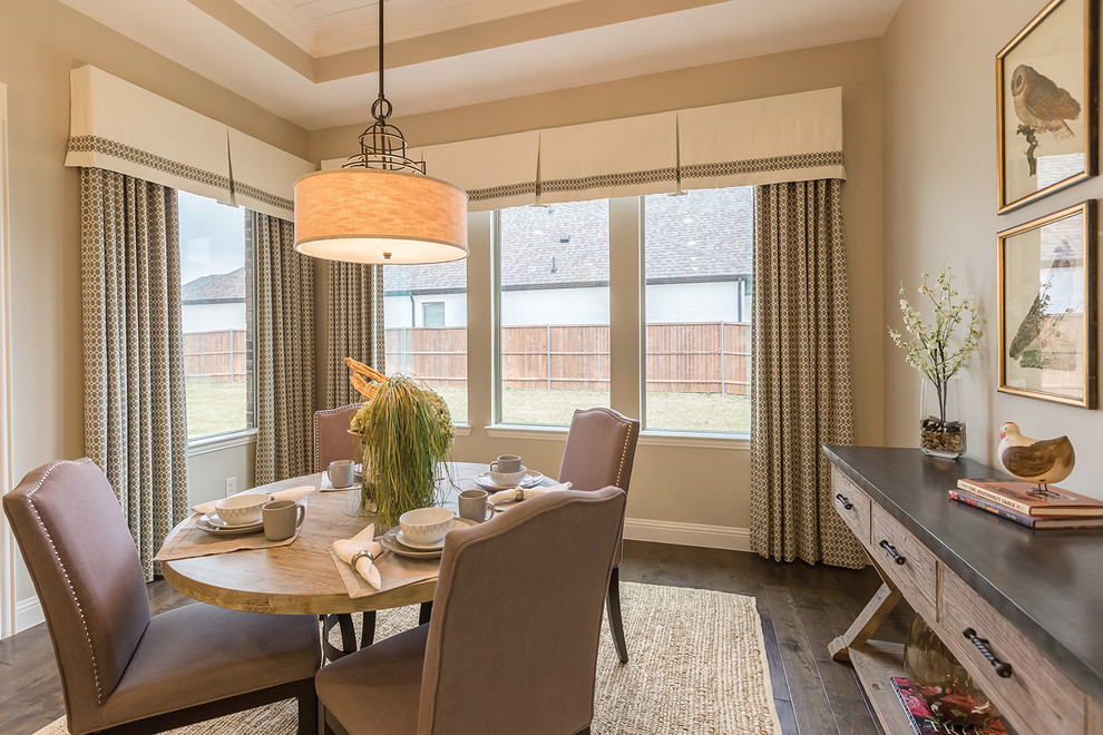 This is an example of a transitional dining room in Other with beige walls and brown floor.