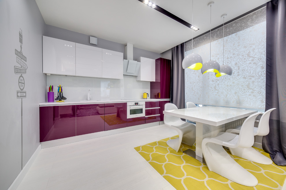 Design ideas for a contemporary single-wall open plan kitchen in Saint Petersburg with a single-bowl sink, flat-panel cabinets, white splashback, white appliances, light hardwood floors, no island and white floor.
