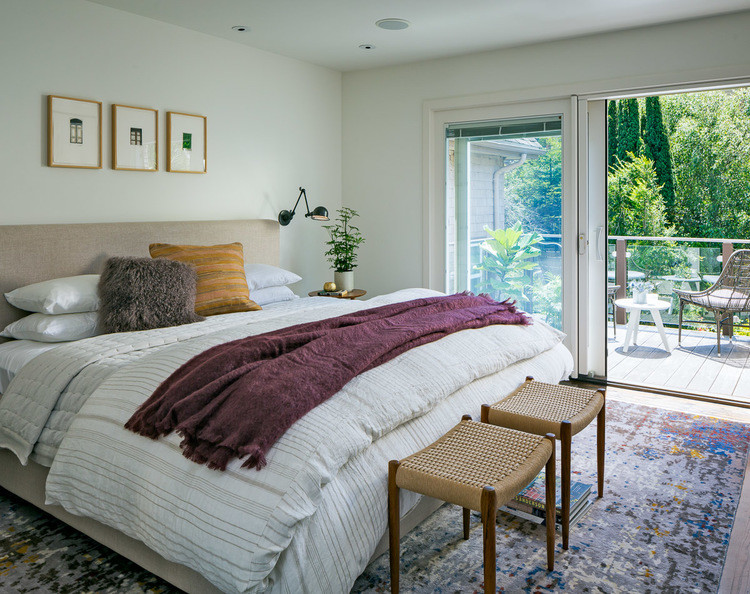 Inspiration for a mid-sized midcentury master bedroom in San Francisco with white walls and dark hardwood floors.
