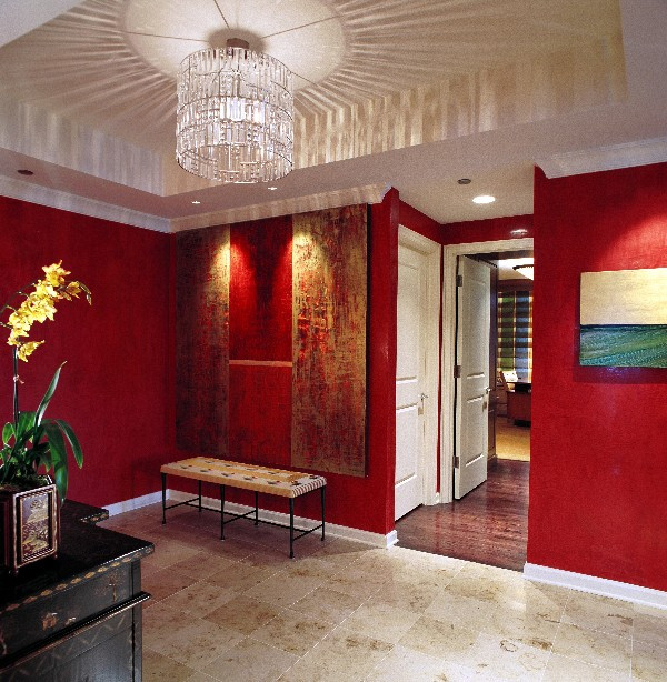 Inspiration for a mid-sized eclectic foyer in Chicago with red walls, marble floors, a single front door and a dark wood front door.