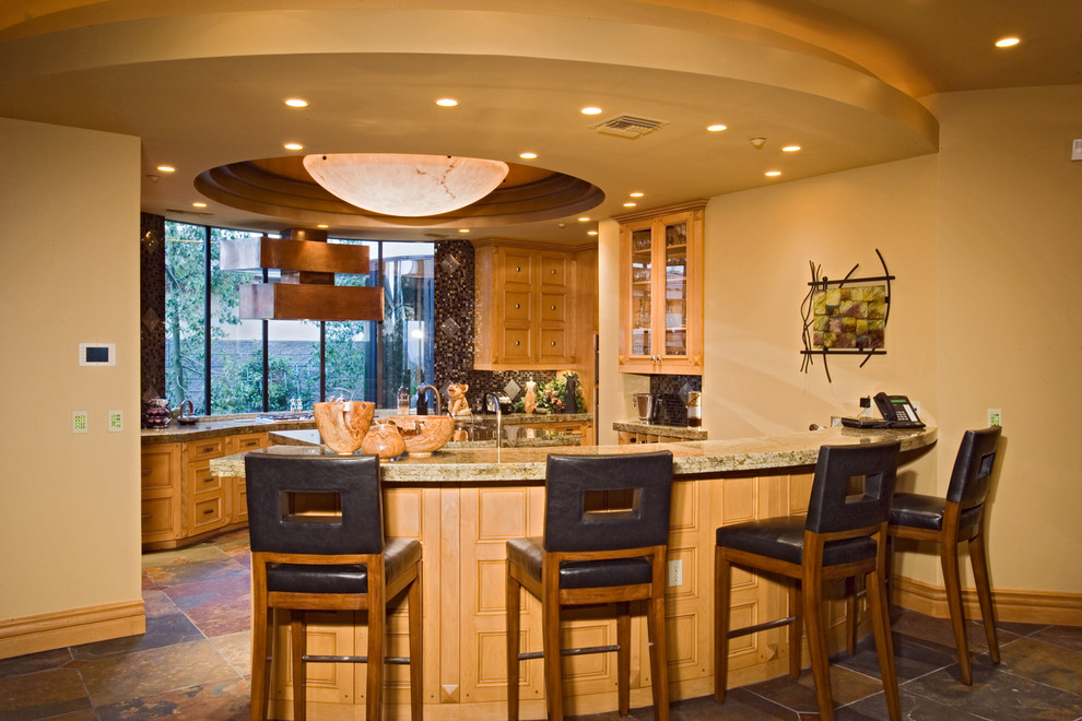 Photo of an expansive arts and crafts galley eat-in kitchen in Las Vegas with a double-bowl sink, medium wood cabinets, multi-coloured splashback, mosaic tile splashback, stainless steel appliances, multiple islands, brown benchtop and vaulted.