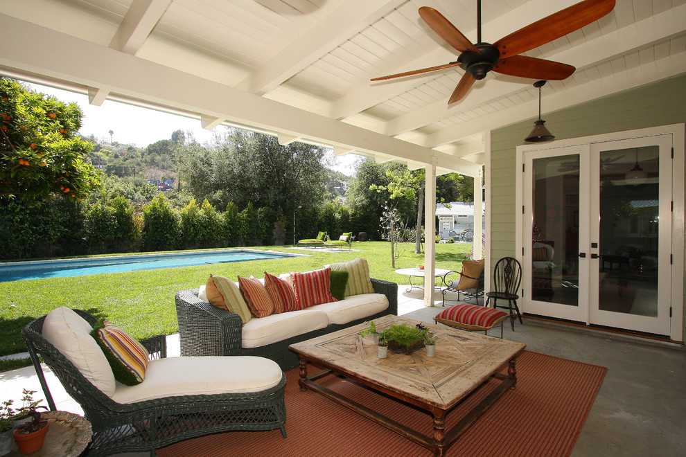 Photo of a country patio in Los Angeles with a roof extension.