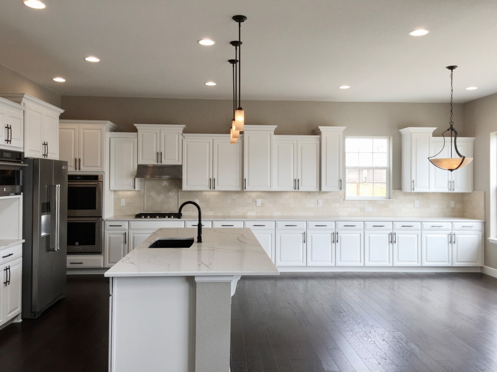 Example of a transitional kitchen design in Denver