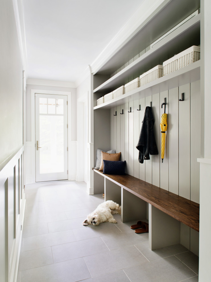 Inspiration for a mid-sized transitional mudroom in New York with grey walls.