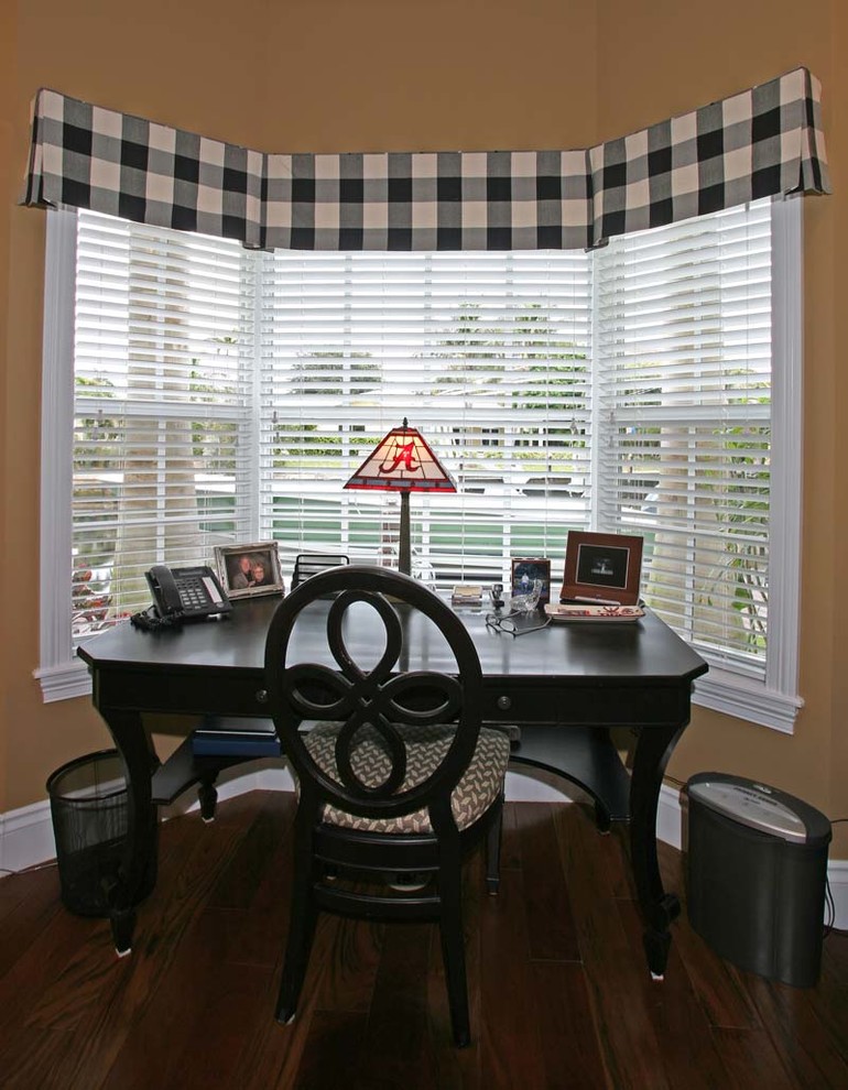 Design ideas for a traditional home office in Tampa with medium hardwood floors and a freestanding desk.