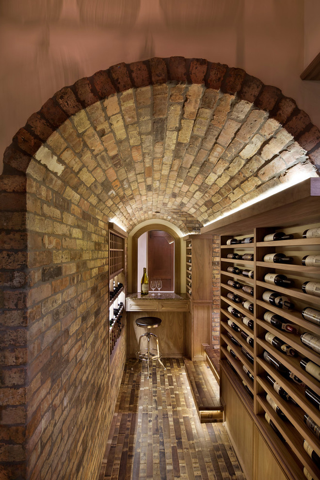 This is an example of a mid-sized contemporary wine cellar in San Francisco with display racks.