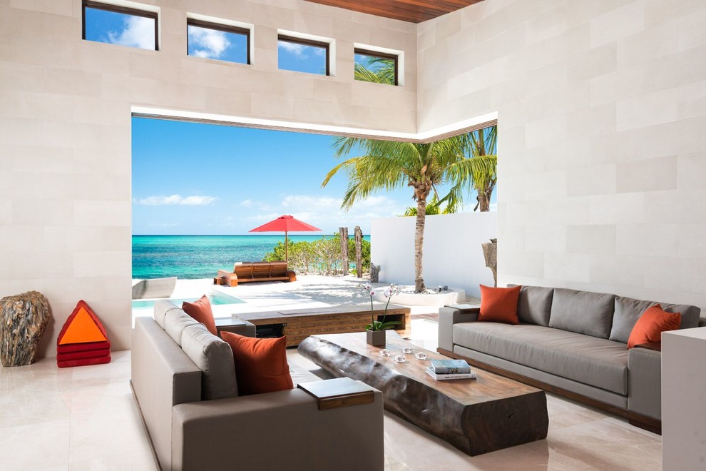 This is an example of a tropical open concept living room.