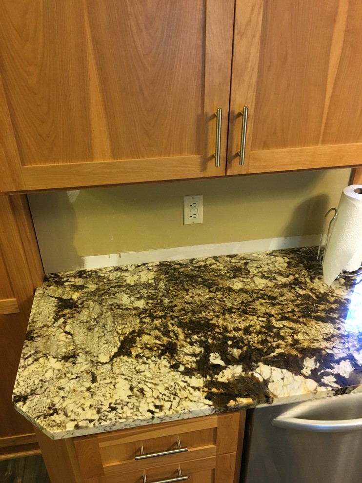 Need backsplash ideas for busy granite countertops in kitchen.