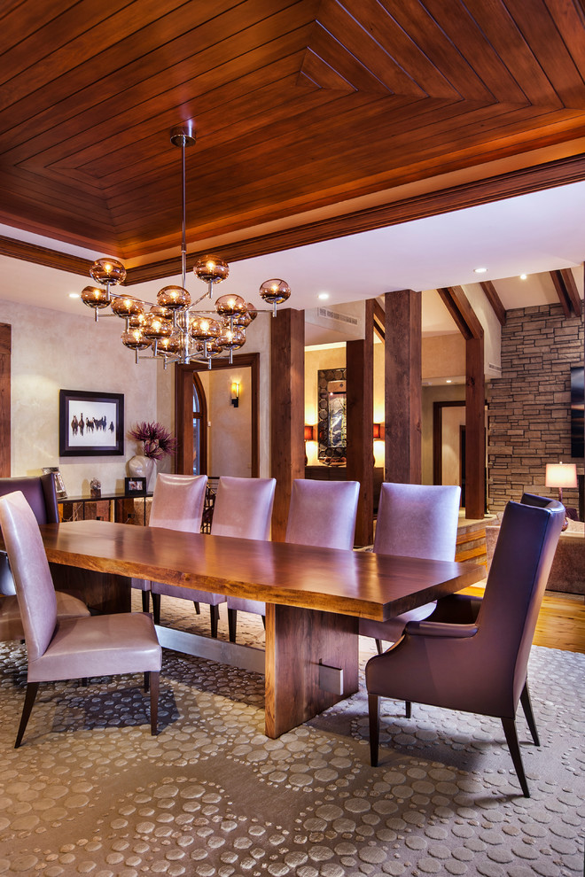 Photo of a large country open plan dining in Denver with white walls, carpet, brown floor and no fireplace.