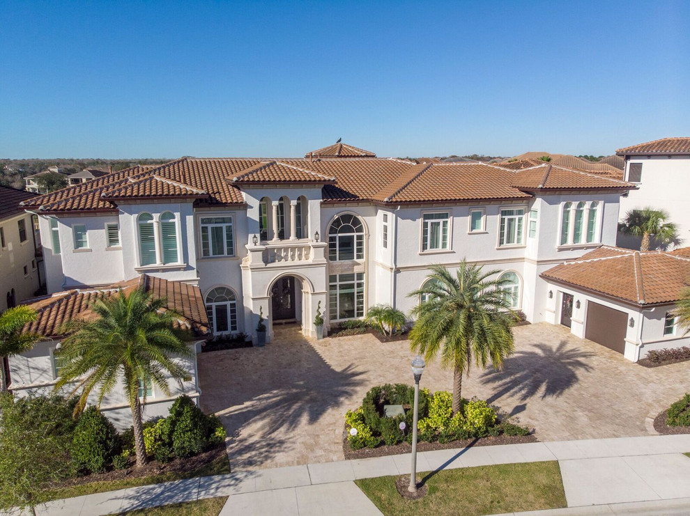 Example of a tuscan home design design in Orlando