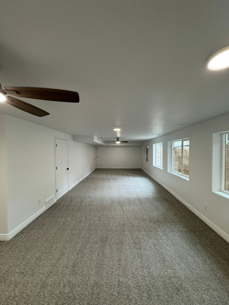 Basement great room finish, ceiling fans and 8" ceiling light with halo rings. a