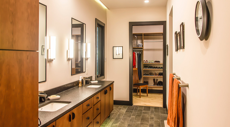 Mid-sized contemporary master bathroom in Other with flat-panel cabinets, light wood cabinets, black tile, beige walls, a curbless shower, porcelain tile, porcelain floors, an undermount sink, granite benchtops, brown floor, an open shower and brown benchtops.