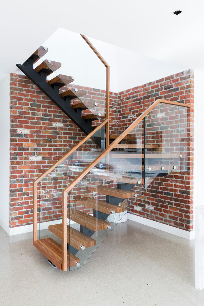 Design ideas for a mid-sized contemporary wood u-shaped staircase in Melbourne.