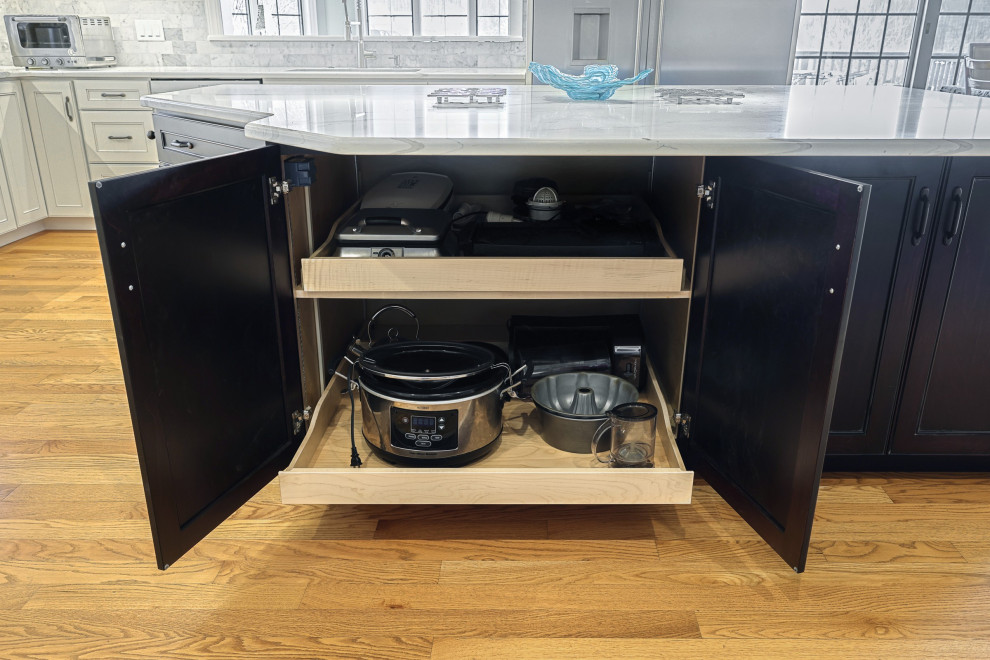Example of a huge transitional u-shaped medium tone wood floor and brown floor eat-in kitchen design with an undermount sink, beaded inset cabinets, dark wood cabinets, quartz countertops, multicolored backsplash, marble backsplash, stainless steel appliances, an island and white countertops