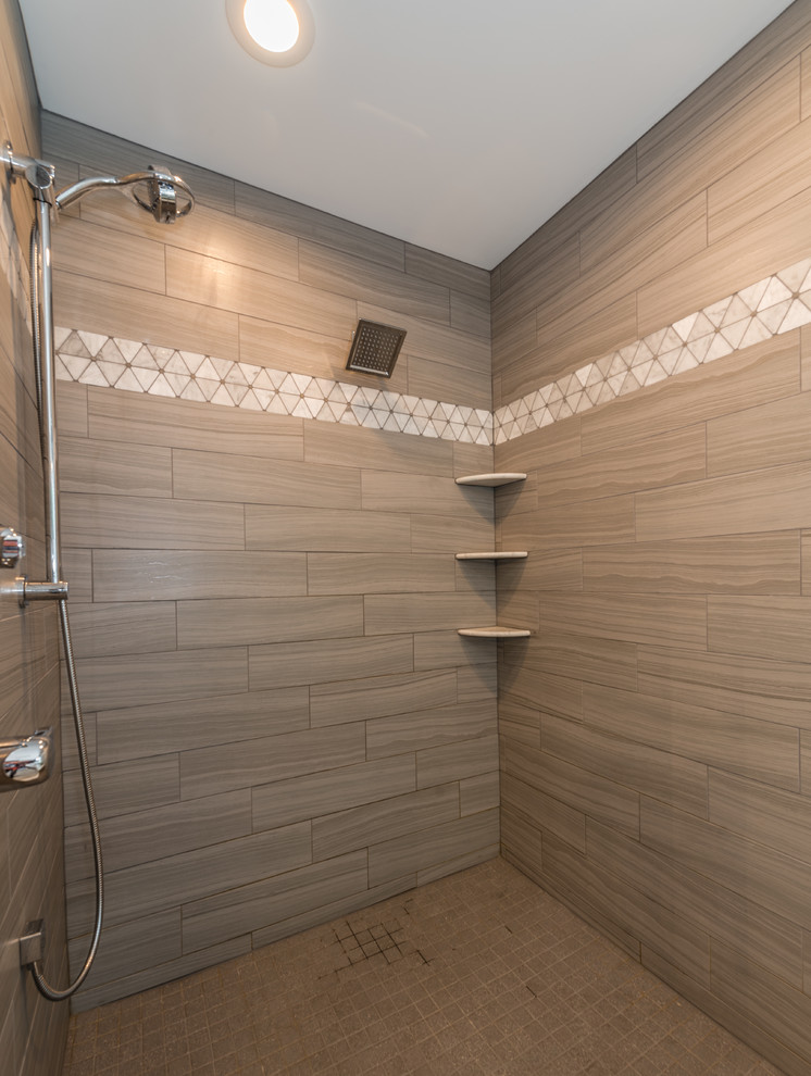 This is an example of a mid-sized transitional 3/4 bathroom in New York with shaker cabinets, white cabinets, an alcove tub, a shower/bathtub combo, a two-piece toilet, beige tile, stone tile, grey walls, vinyl floors, an undermount sink, quartzite benchtops, beige floor and a shower curtain.