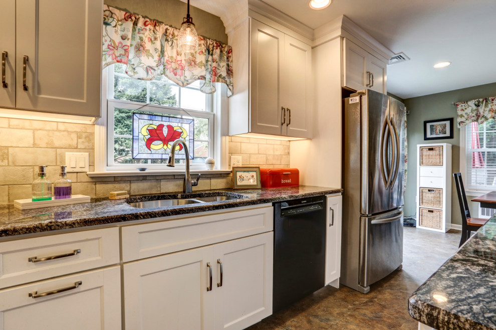 Inspiration for a mid-sized l-shaped eat-in kitchen remodel with white cabinets, granite countertops, stainless steel appliances and an island