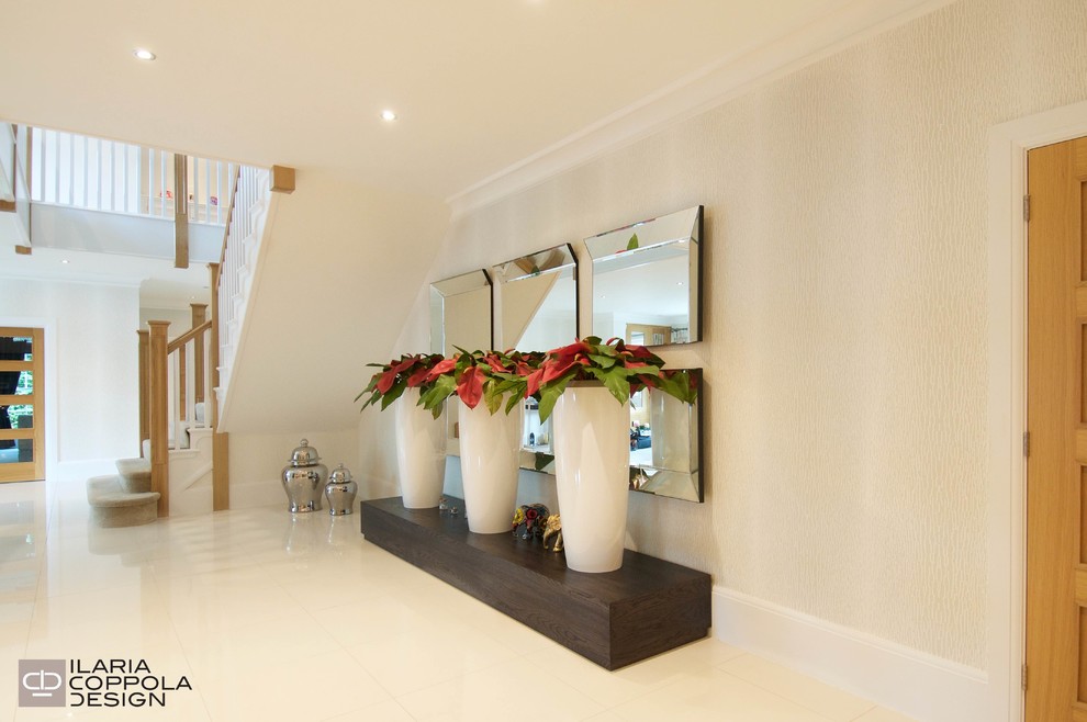 Expansive contemporary hallway in London with beige walls and ceramic floors.