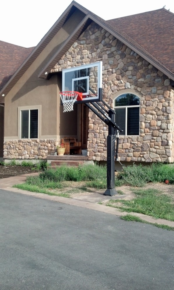Inspiration for a large traditional front yard outdoor sport court in Salt Lake City with concrete pavers.