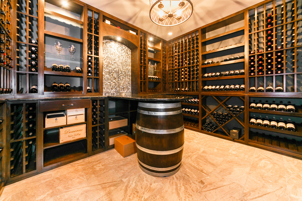 Photo of a large traditional wine cellar in New York with marble floors and display racks.