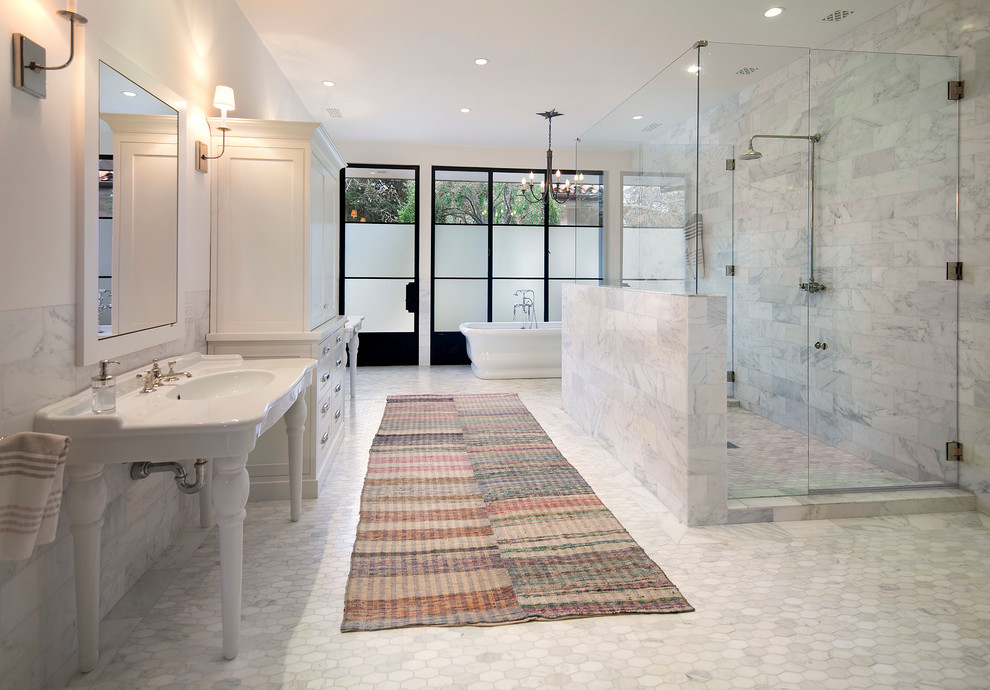 Inspiration for a large traditional master bathroom in Santa Barbara with shaker cabinets, white cabinets, a freestanding tub, white tile, stone tile, a console sink, white walls and mosaic tile floors.