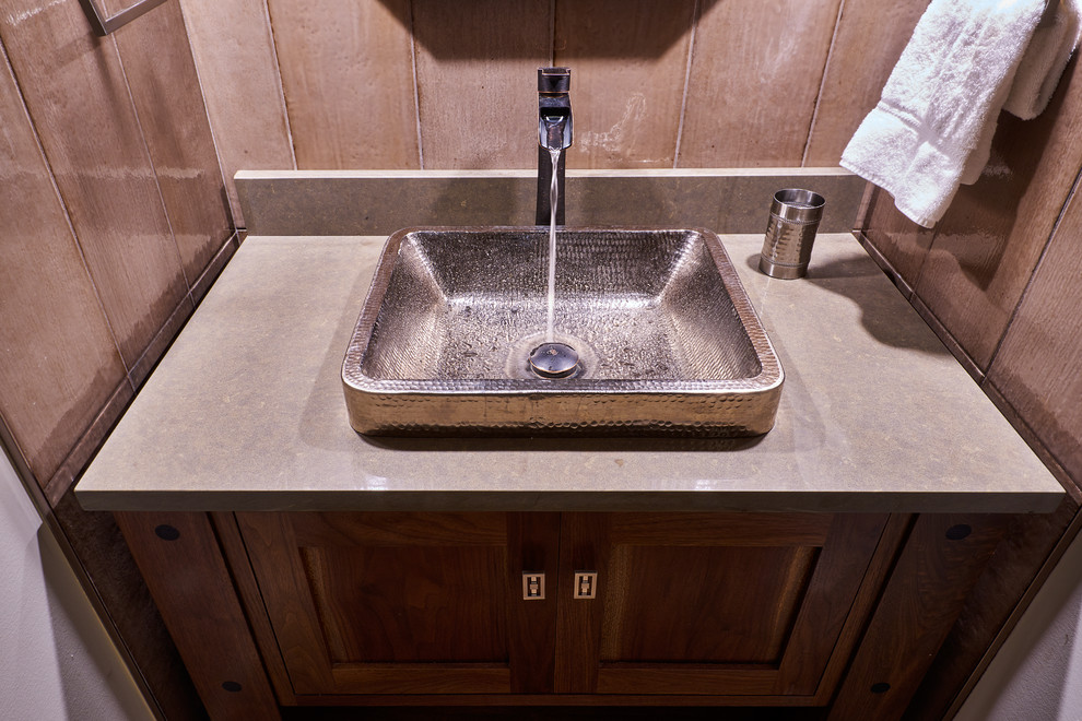 Inspiration for a small transitional single-wall medium tone wood floor, brown floor and vaulted ceiling enclosed kitchen remodel with a single-bowl sink, recessed-panel cabinets, medium tone wood cabinets, granite countertops, gray backsplash, ceramic backsplash, stainless steel appliances and gray countertops
