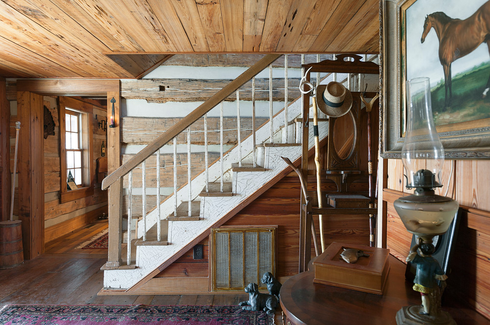 Design ideas for a mid-sized country wood straight staircase in Charleston with wood risers.