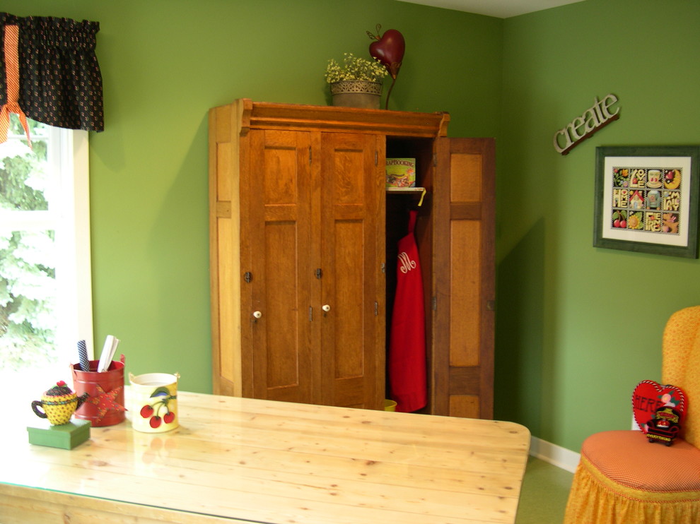 Playroom - farmhouse gender-neutral vinyl floor playroom idea in Grand Rapids with green walls