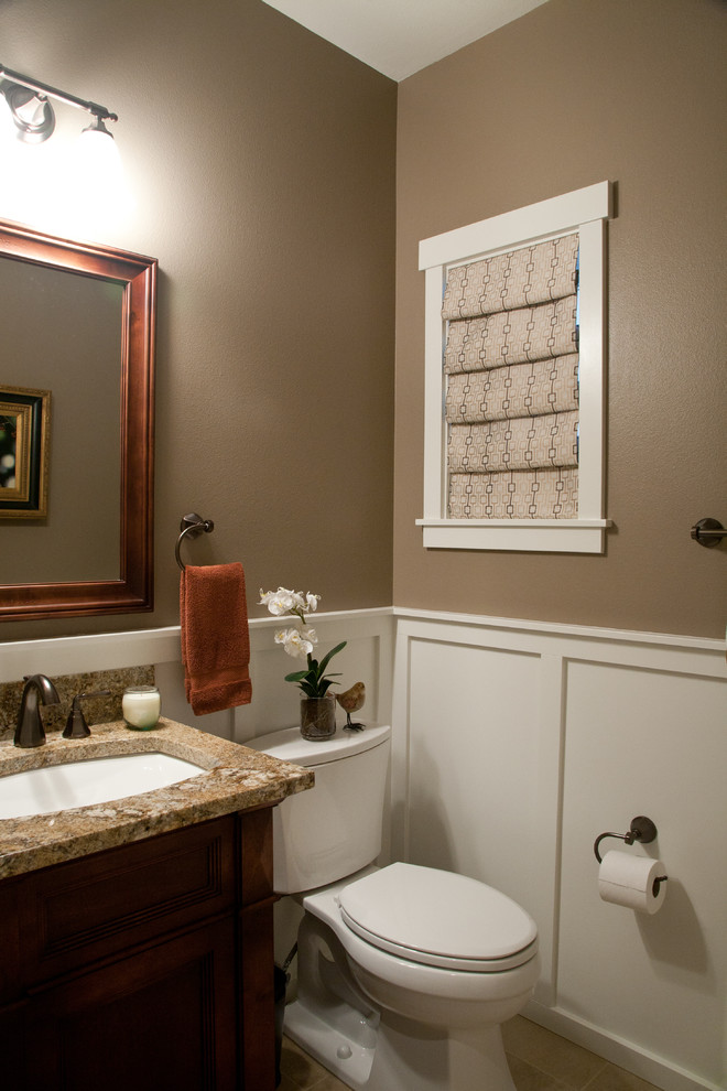 Inspiration for a small traditional 3/4 bathroom in Seattle with an undermount sink, dark wood cabinets, granite benchtops, a two-piece toilet, brown walls, furniture-like cabinets, ceramic floors and brown benchtops.