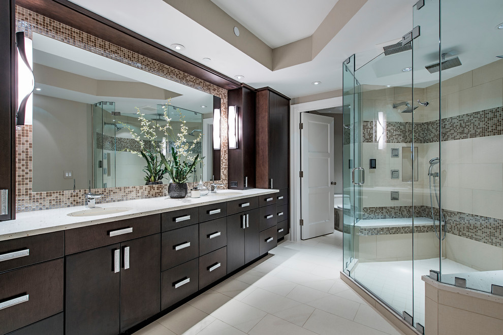 This is an example of a beach style master bathroom in Denver with flat-panel cabinets, brown cabinets, an alcove shower, beige tile, brown tile, mosaic tile, beige walls, an undermount sink, beige floor, a hinged shower door, beige benchtops and quartzite benchtops.