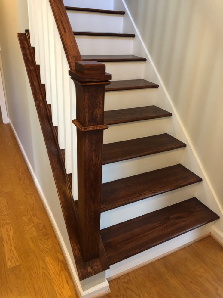 Wooden straight wood railing staircase photo with painted risers